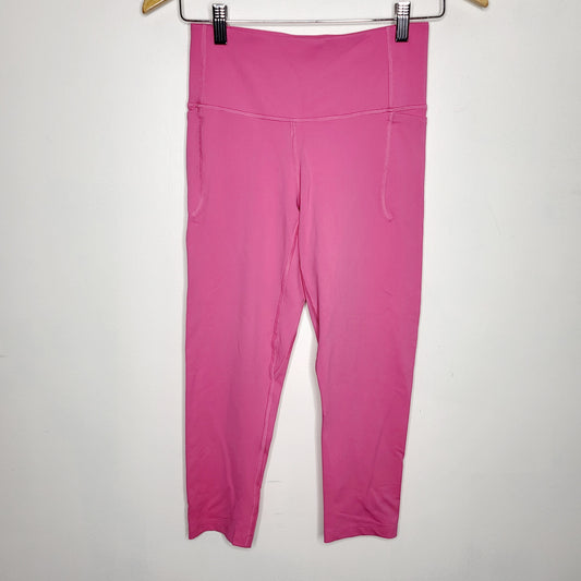JKZ22 - Under Armour pink cropped active leggings, size small, good condition