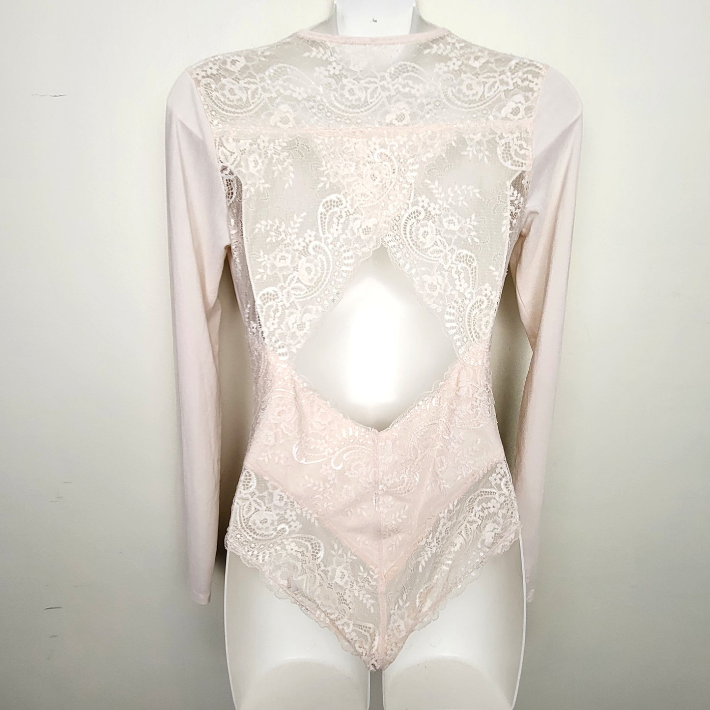 CMCRD2 - Pale pink lacey bodysuit with cut-out at back. Approx size small