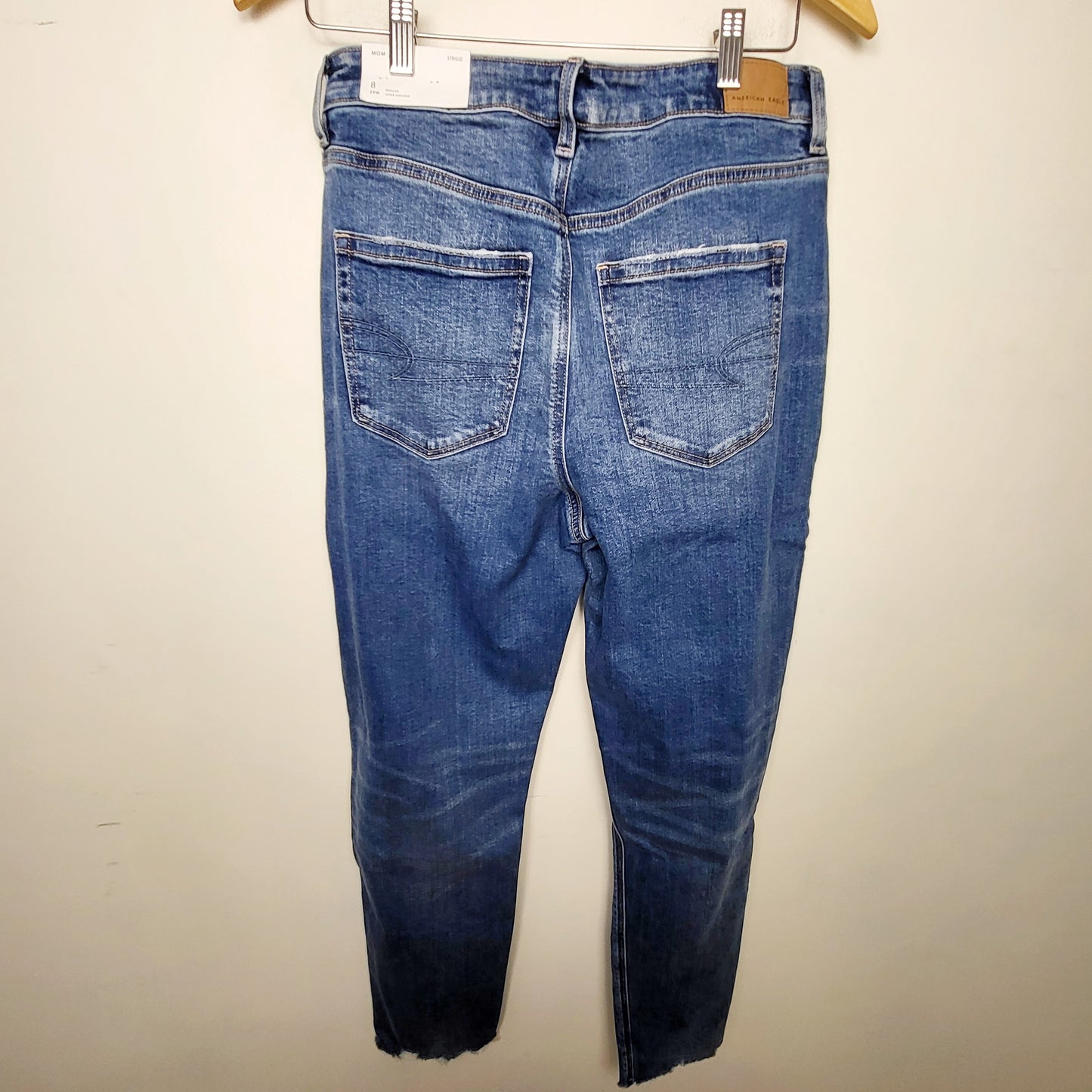 MFAIR1 - NEW - American Eagle distressed Strigid Jeans with raw edge hem. Size 8 (29)