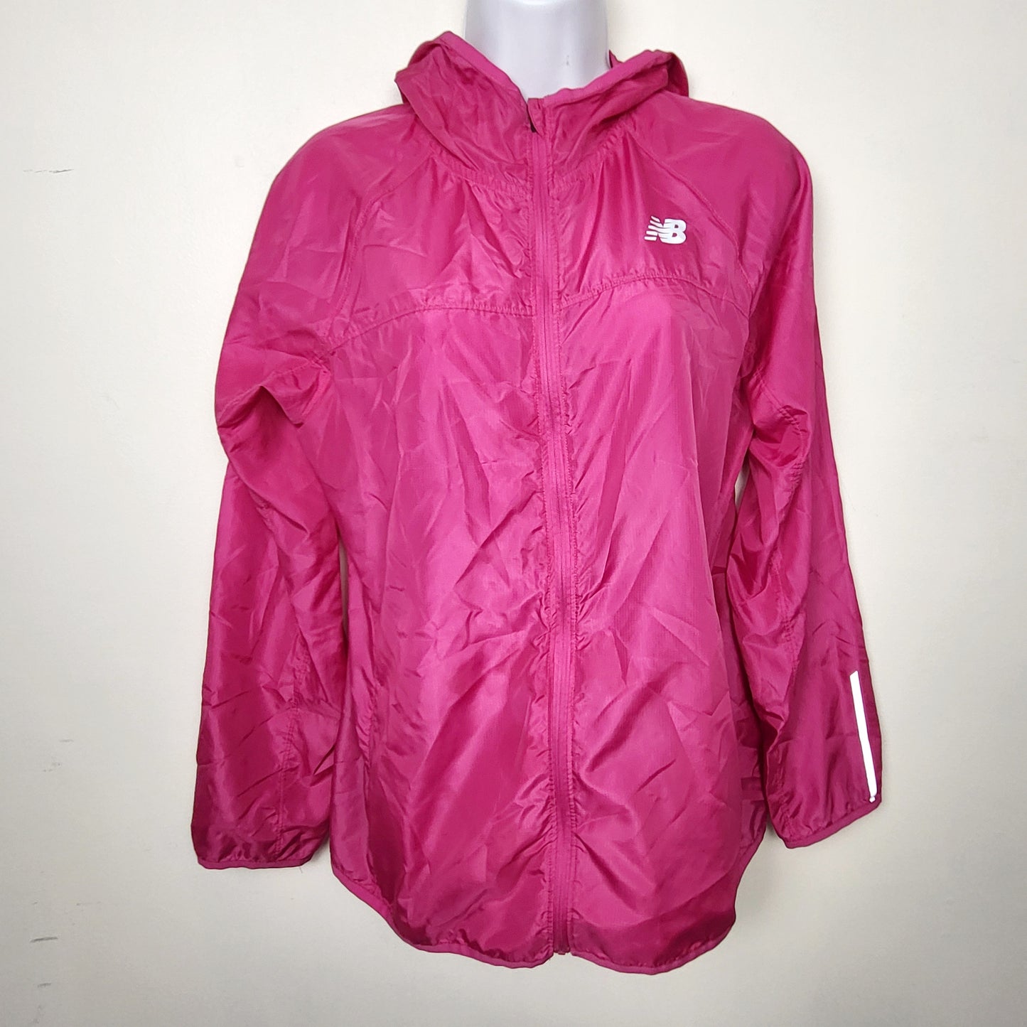 BBIN1 - New Balance pink hooded windbreaker with reflective strips. Size medium
