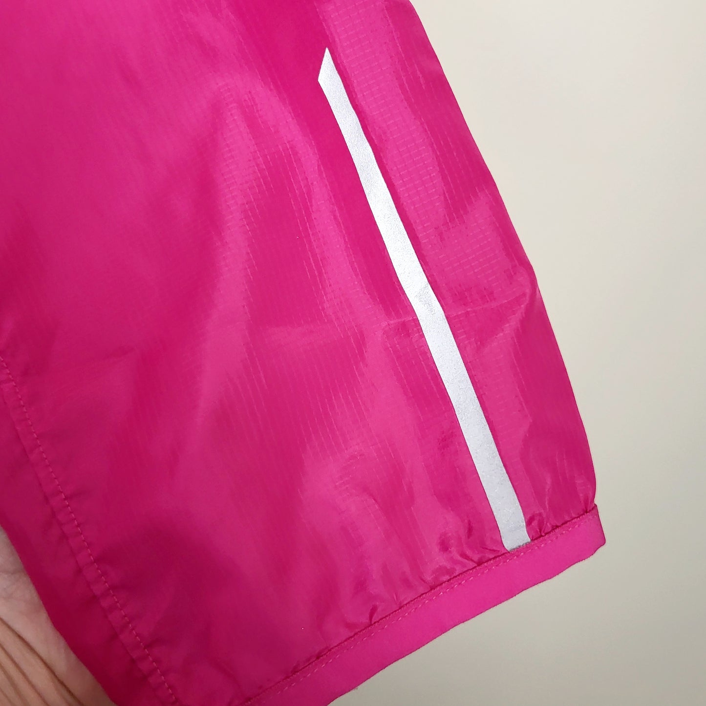 BBIN1 - New Balance pink hooded windbreaker with reflective strips. Size medium