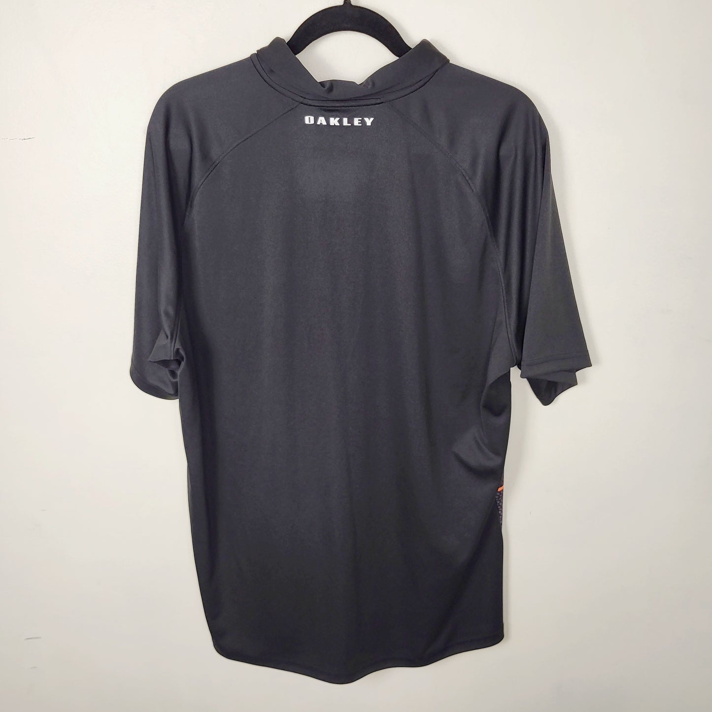 JUDR1 - Oakley black and orange golf shirt. Men's size XL