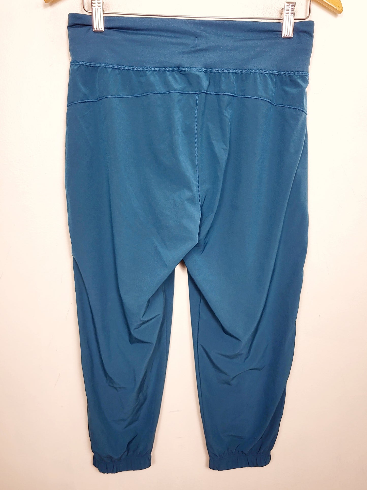 Under Armour teal cropped active joggers. Approx size small