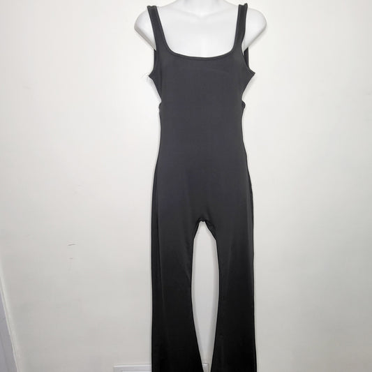 SHCA11 - Black flare leg form fitting jumpsuit with open back, size small, good condition