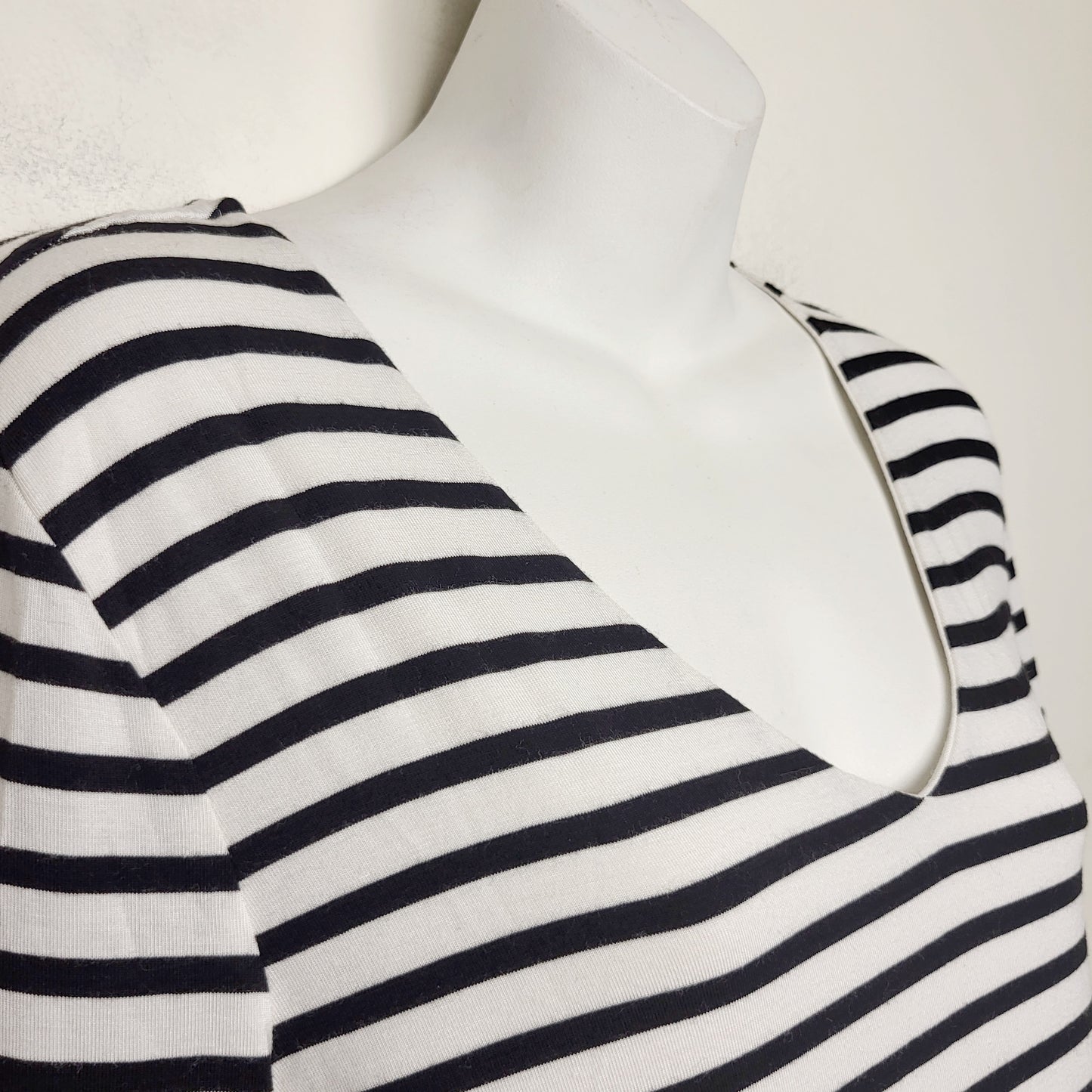 MBRS - Sung by Alfred Sung black and white striped v-neck top. Size medium
