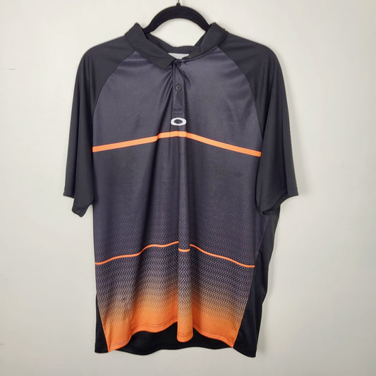 JUDR1 - Oakley black and orange golf shirt. Men's size XL