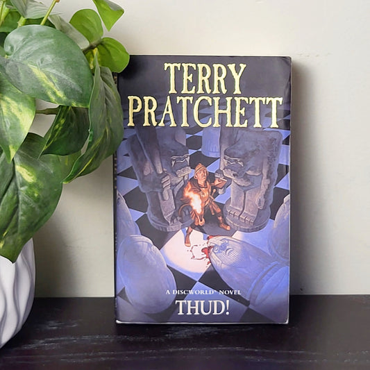MFAIR - Thud.  Soft cover Terry Pratchett novel.  NO SHIPPING