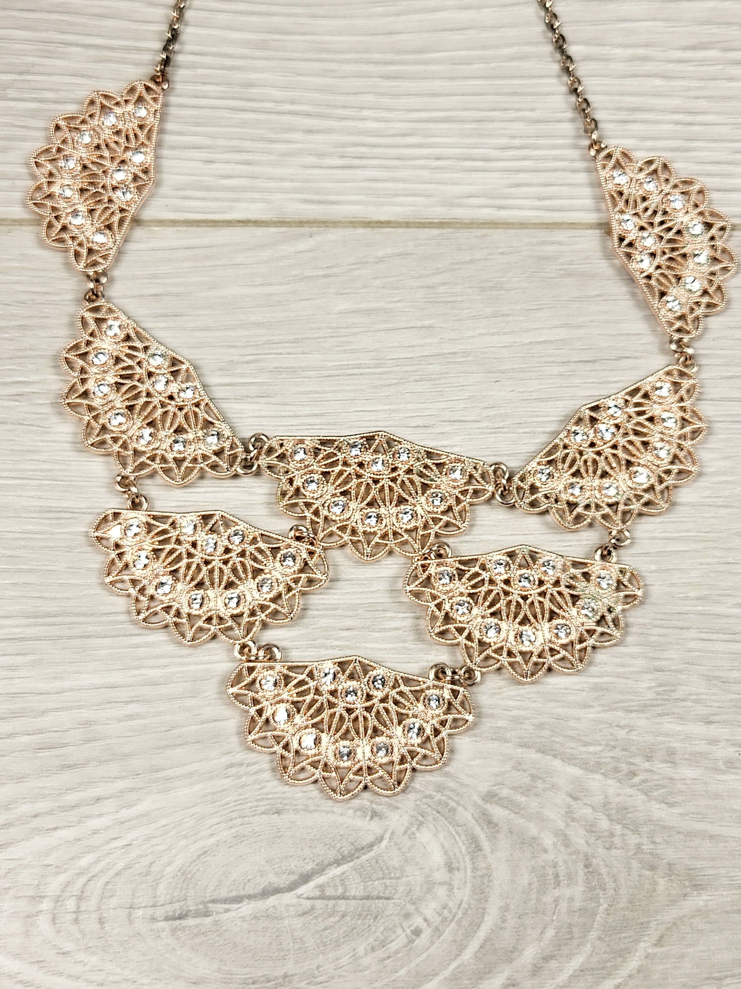 CHSP1 - I.N.C. rose gold toned crystal filigree jewelry set.