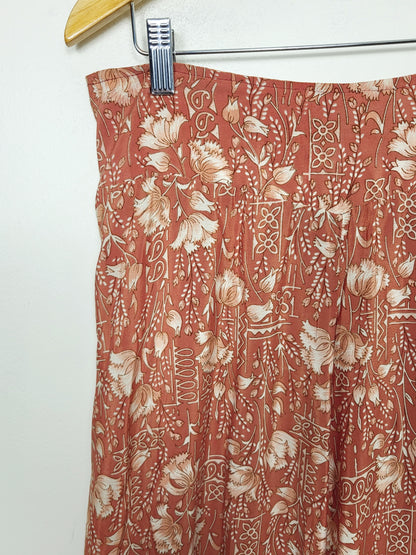 BRNA - Chai Fashions burnt orange floral patterned wide leg silk palazzo pants. Size medium
