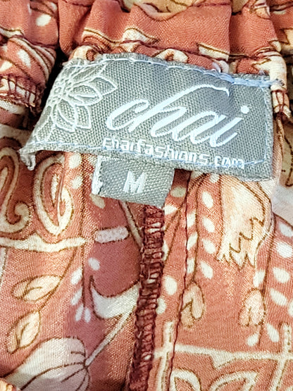 BRNA - Chai Fashions burnt orange floral patterned wide leg silk palazzo pants. Size medium