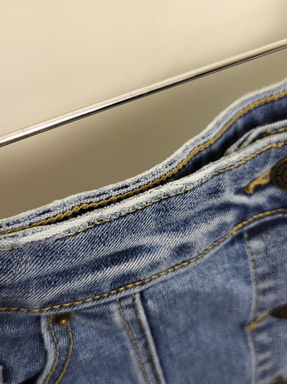 BRNA1 - Vero Moda distressed denim skirt. Size large (measures like a medium)