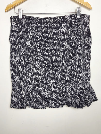 Ann Taylor black and white pencil skirt with ruffle hem. Size 12