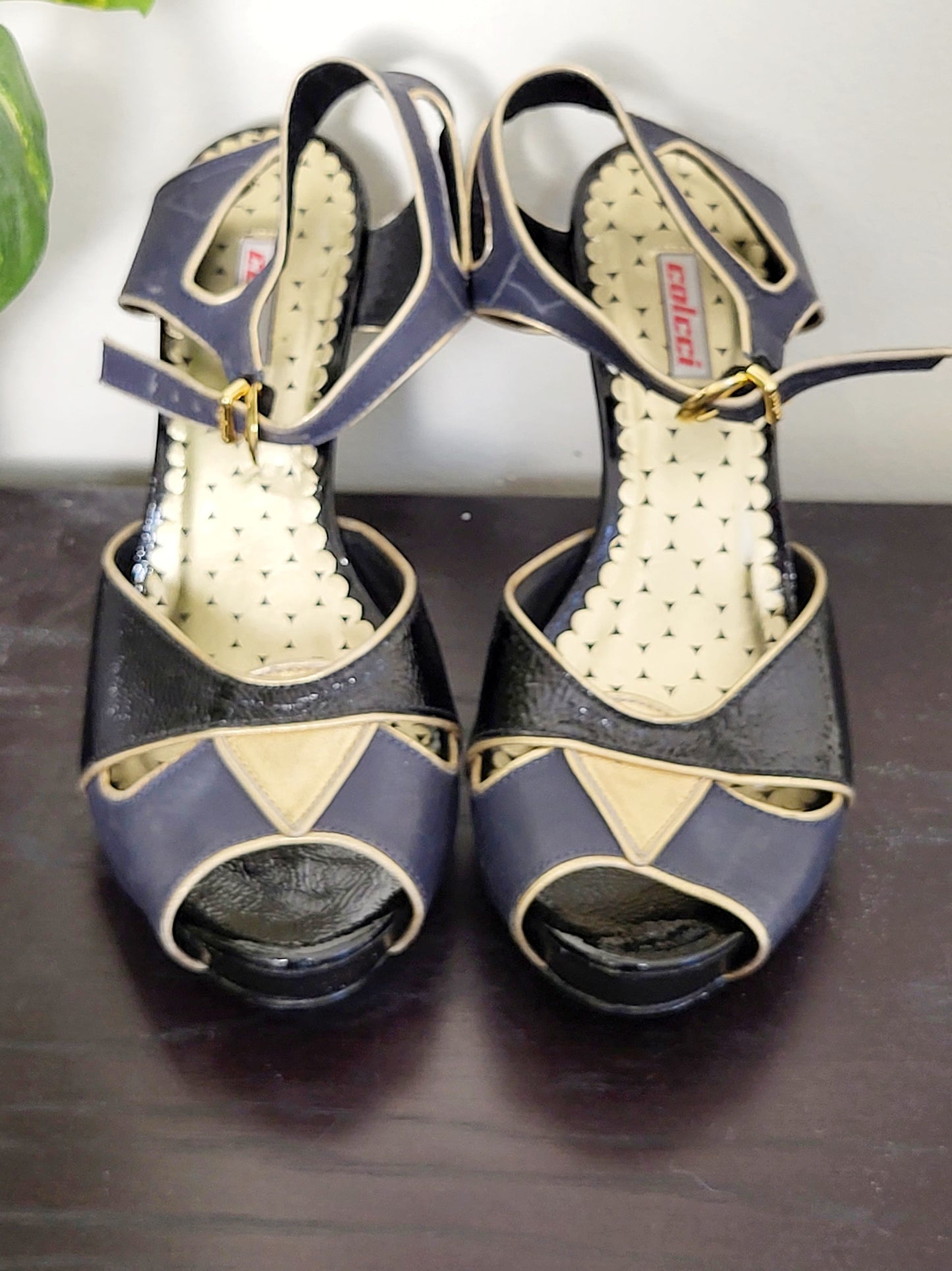 Colcci black and navy peep toe leather heels with gold trim. Size 7