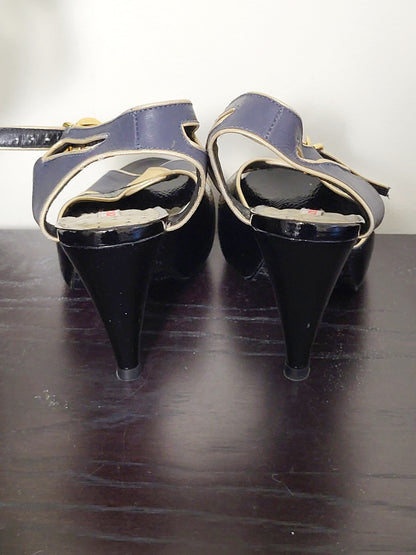 Colcci black and navy peep toe leather heels with gold trim. Size 7