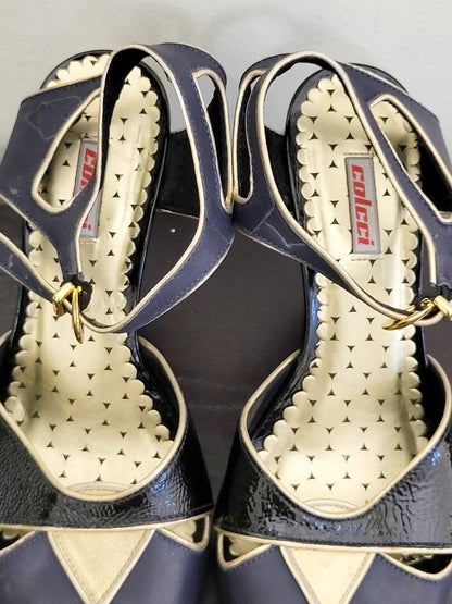 Colcci black and navy peep toe leather heels with gold trim. Size 7