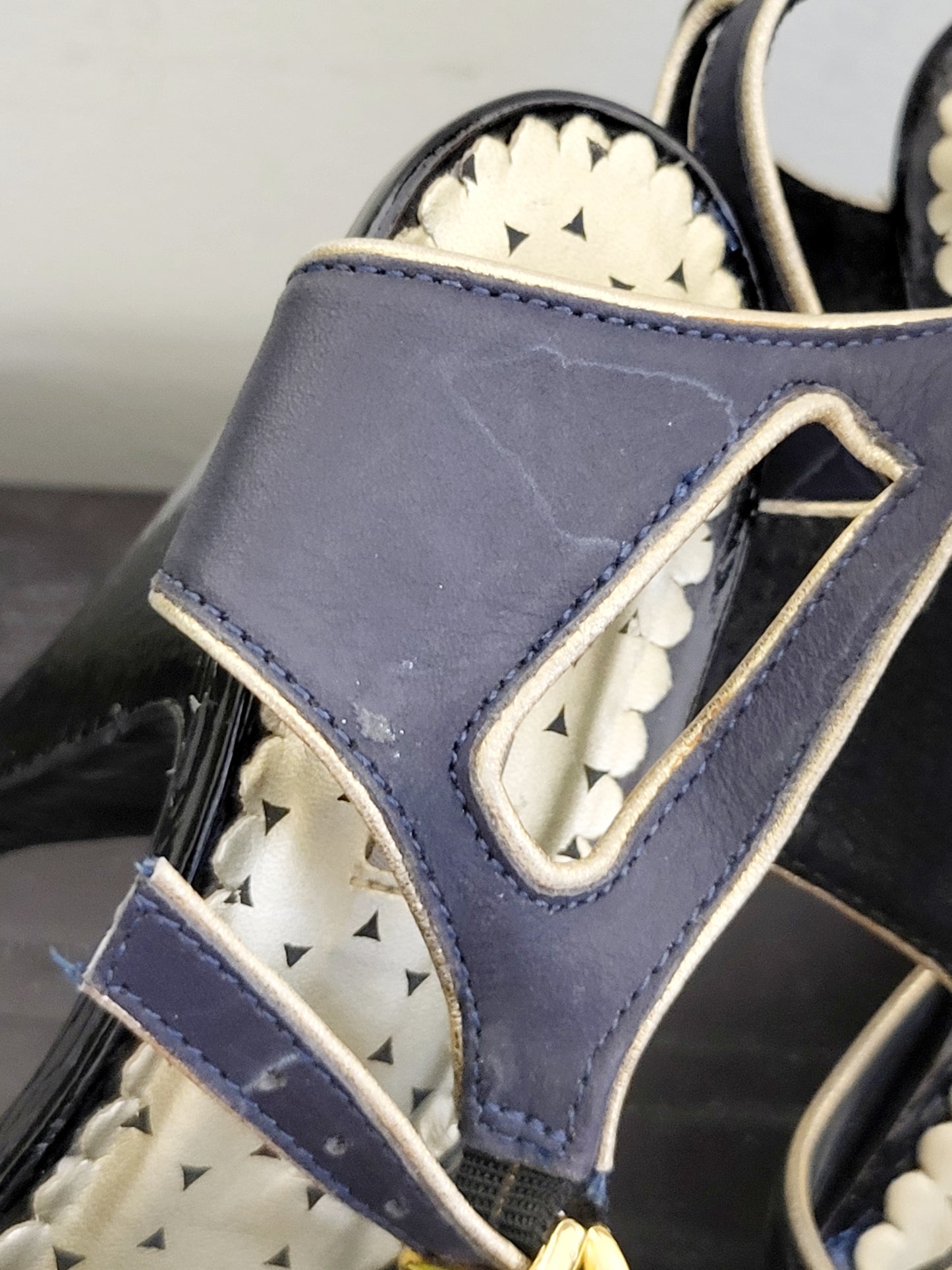 Colcci black and navy peep toe leather heels with gold trim. Size 7