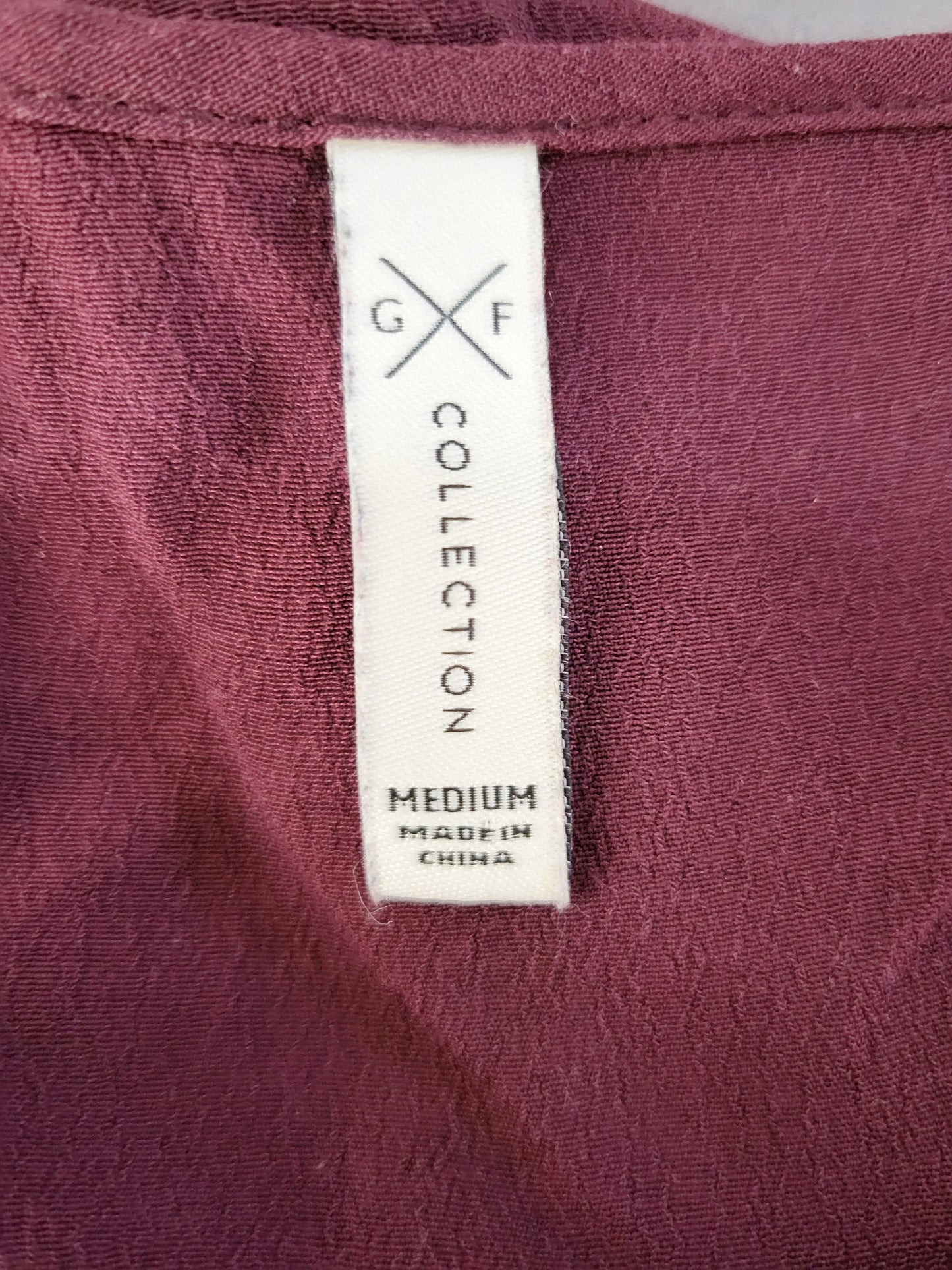 Gentle Fawn plum coloured top. Size small