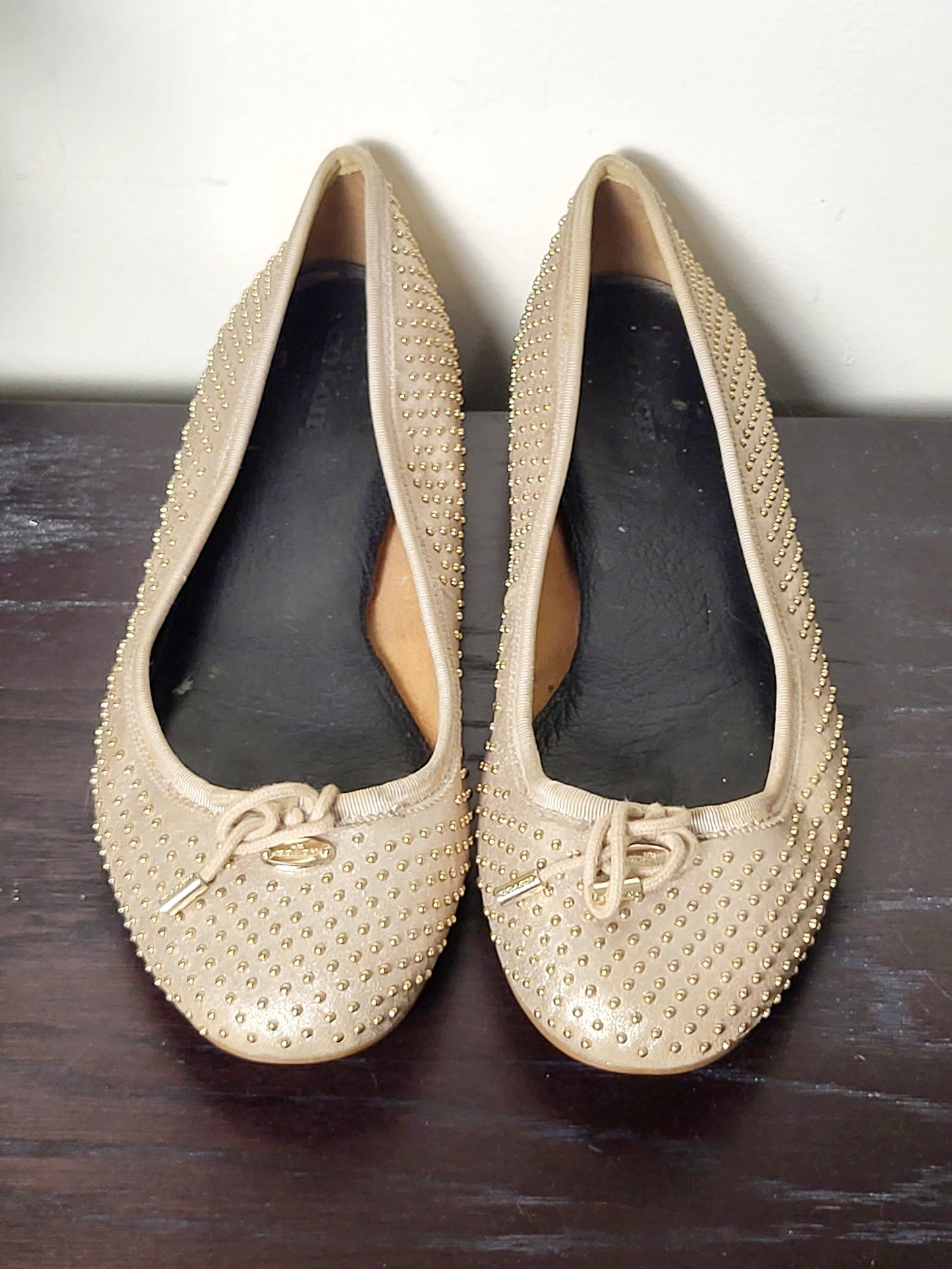 Coach Lara studded metallic ballet flats in a dull gold/nude colour. Size 39 (US size 8)