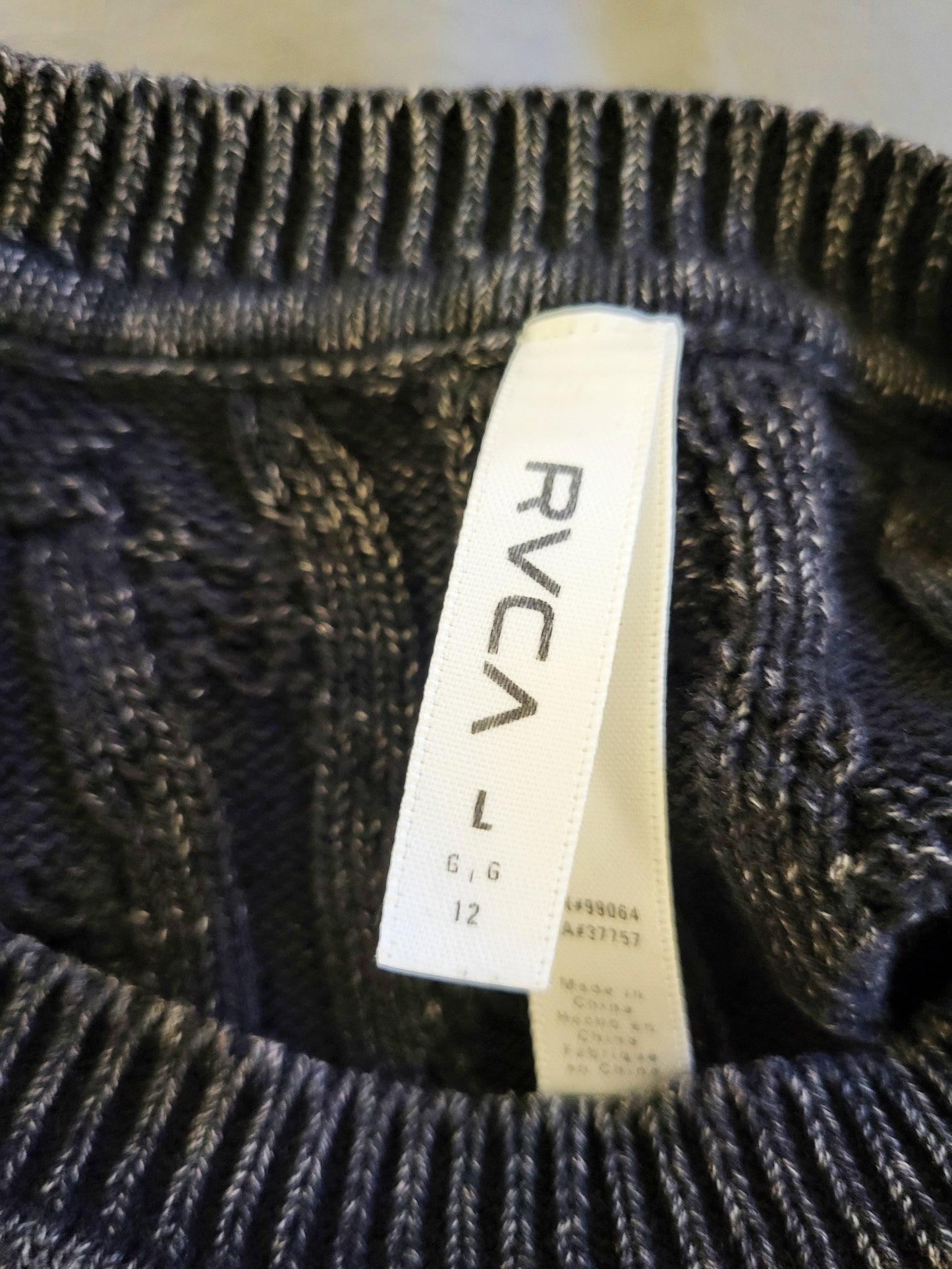 RVCA black and grey distressed cable knit sweater. Size large