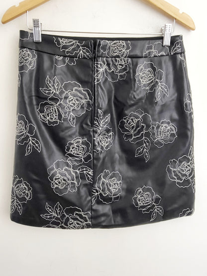 RW and Co. black floral embroidered faux leather mini skirt. Size 8