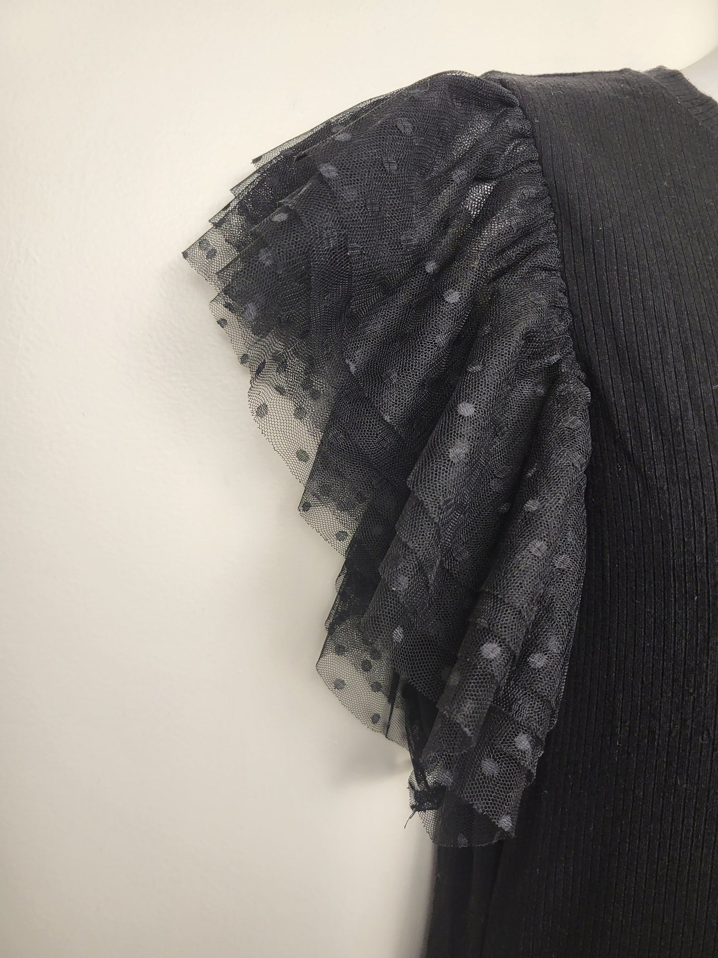 Black rib knit top with plka dot tulle sleeves | Size MEDIUM