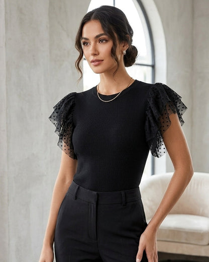Black rib knit top with plka dot tulle sleeves | Size MEDIUM