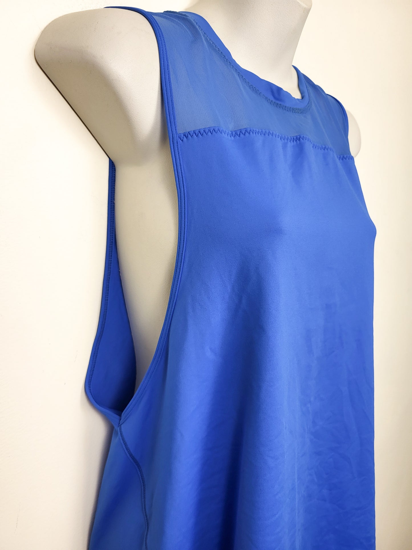 Lululemon blue loose fit athletic tank with mesh accents. Sizes like a 4