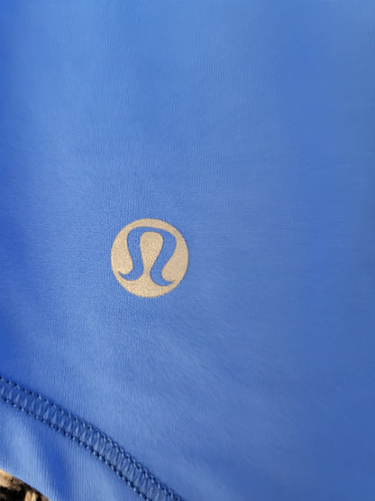 Lululemon blue loose fit athletic tank with mesh accents. Sizes like a 4